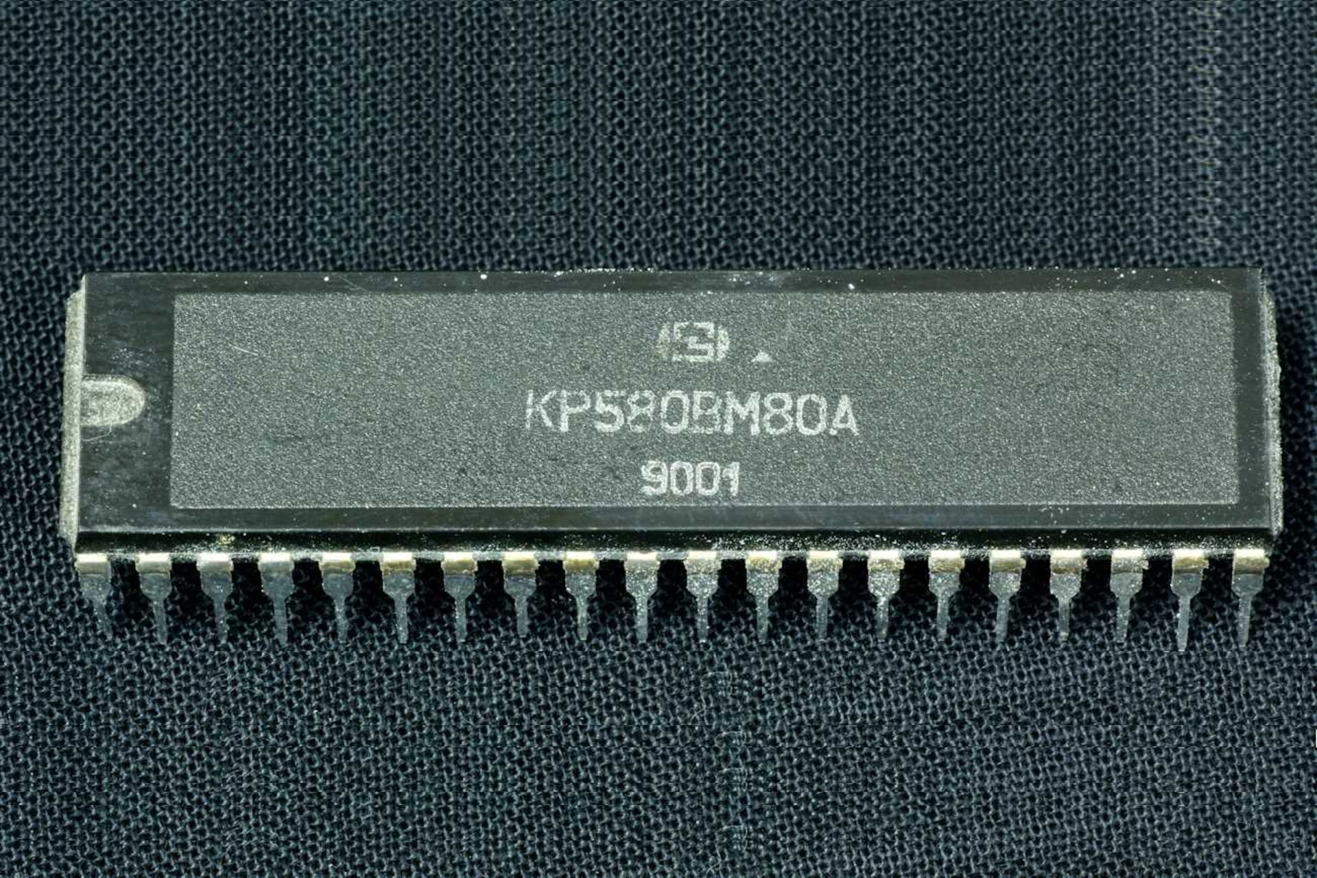 Soviet 850 processor on a denim background with Russian writing on it