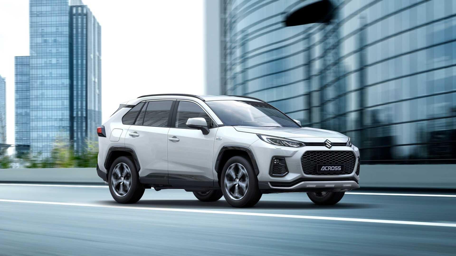 خودرو شاسی بلند سوزوکی اکراس / Suzuki Across سفید رنگ در کنار ساختمان 
