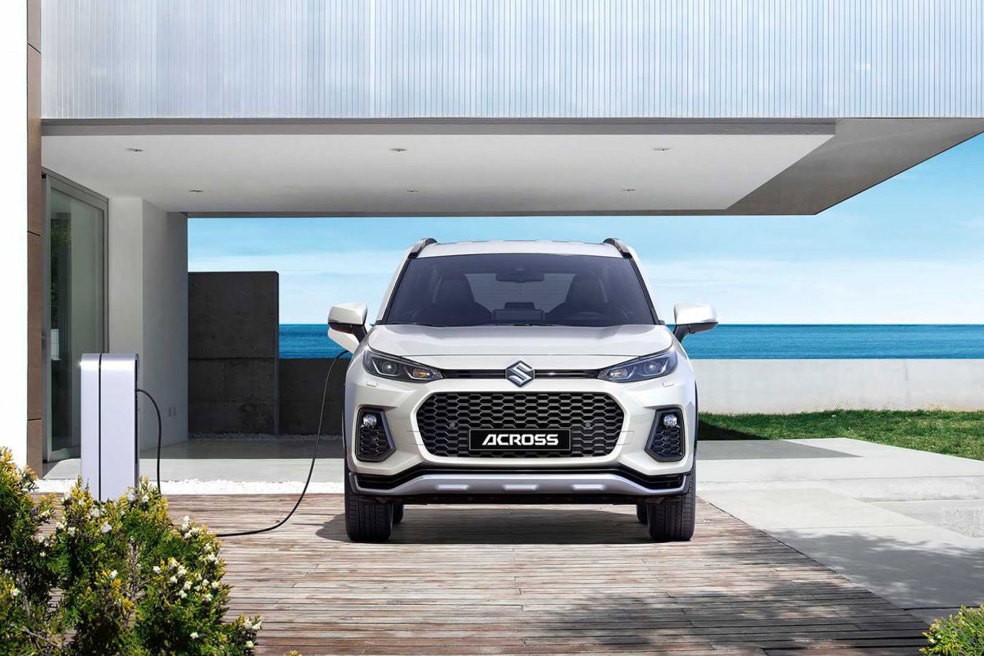 نمای جلو شاسی بلند هیبریدی سوزوکی اکراس / Suzuki Across سفید رنگ در حال شارژ