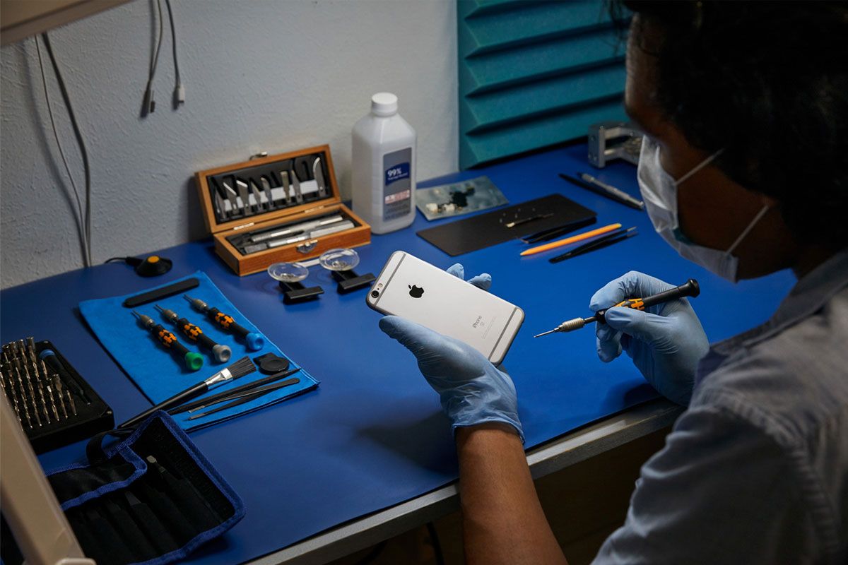 Technician repairing iPhone