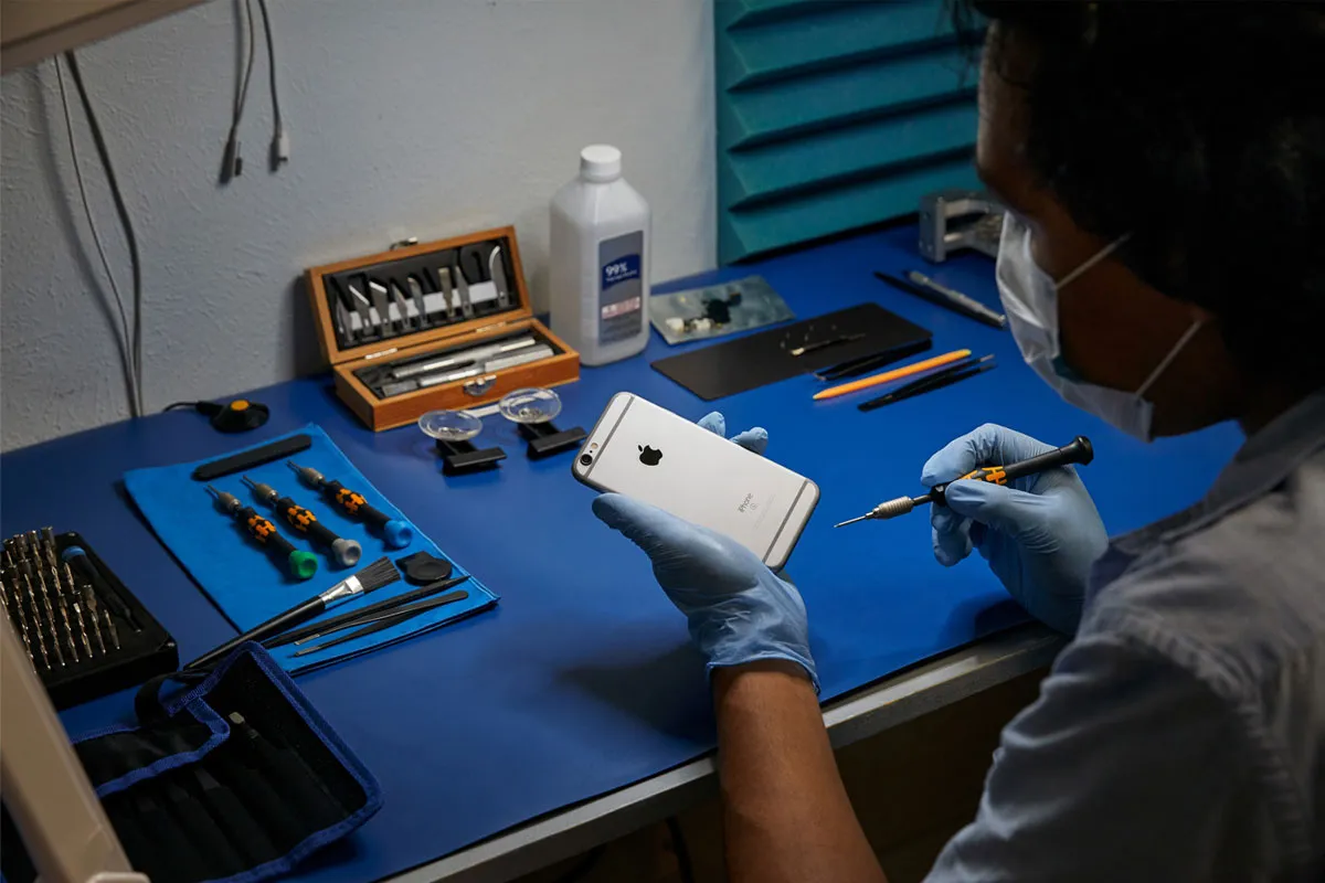 Technician repairing iPhone