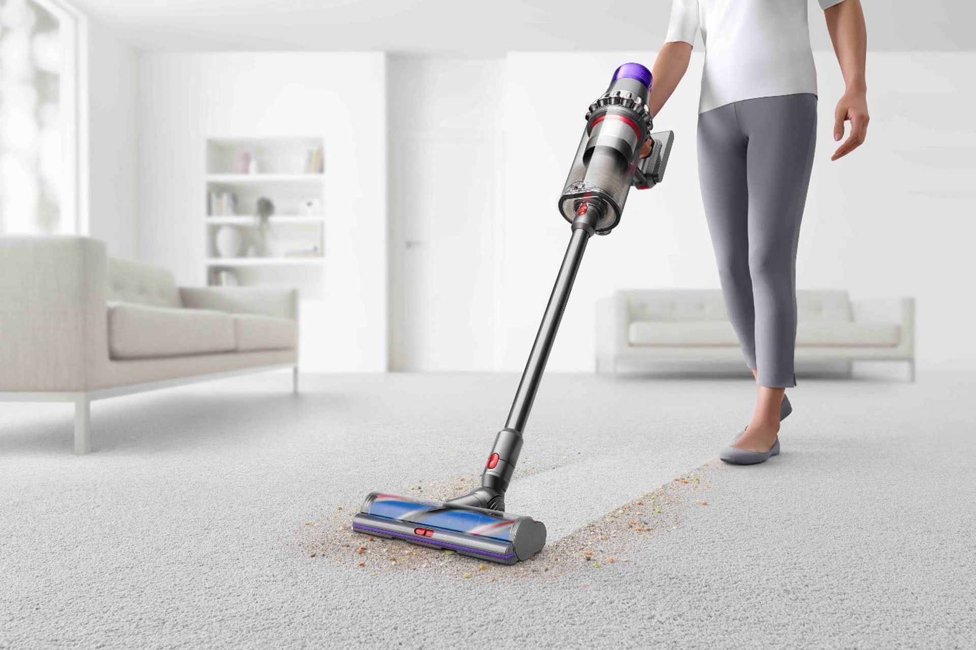 یک زن در حال استفاده از جاروبرقی دایسون Dyson V15 Detect طرح گرافیکی