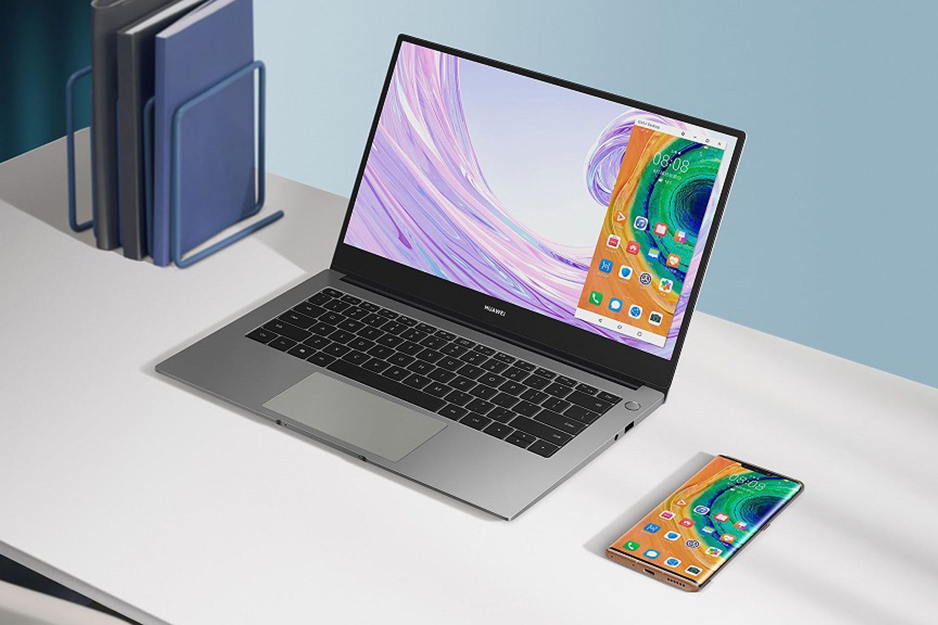 میت بوک دی ۱۴ / MateBook D14 هواوی روی میز با گوشی