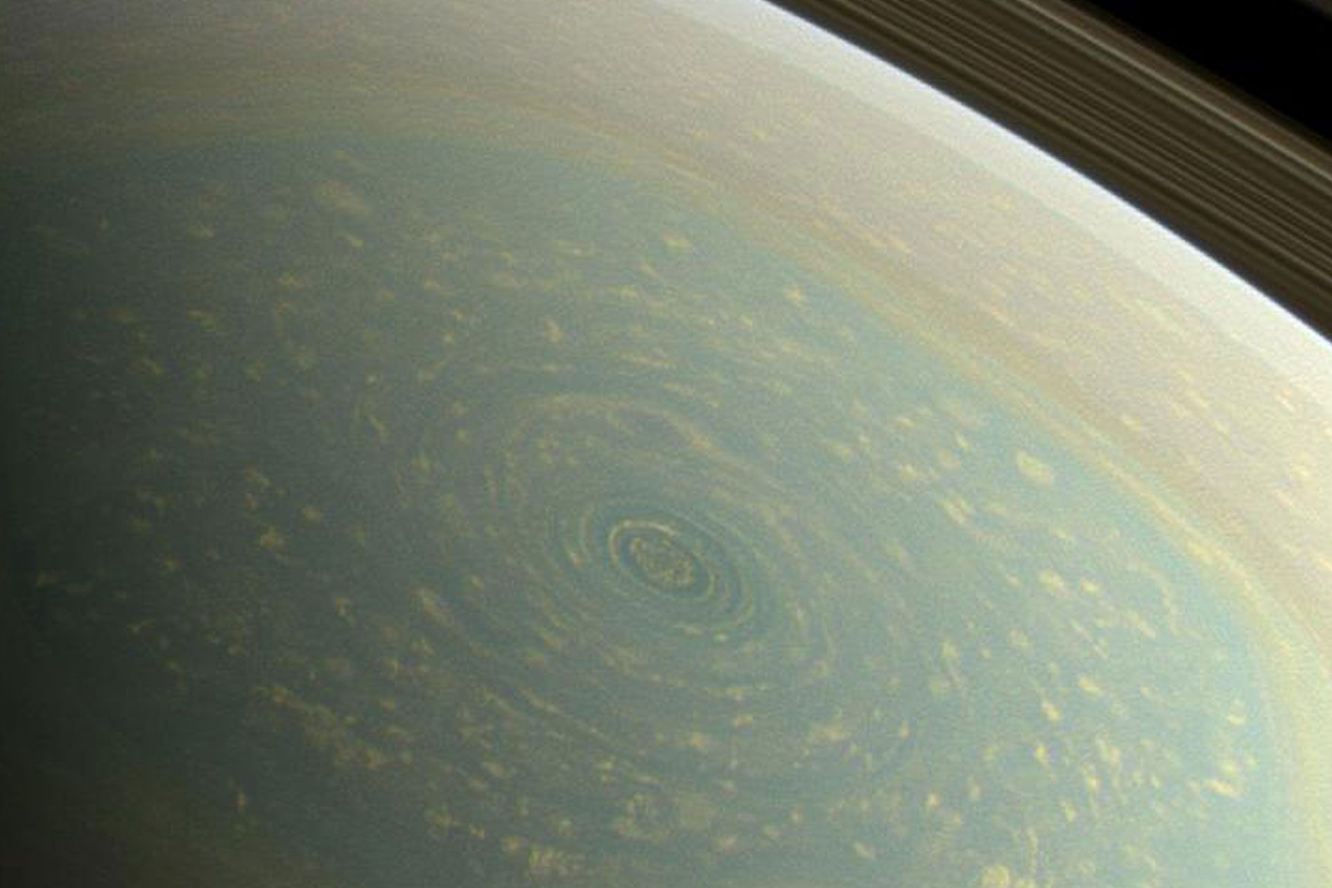 Spring at Saturn's North Pole: A View of the Hexagonal Storm