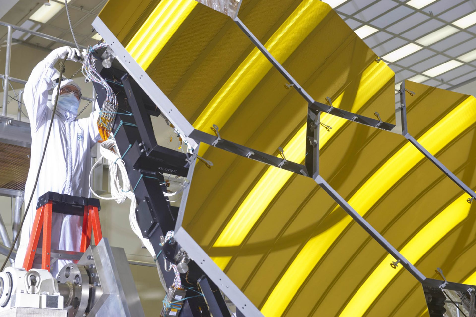 NASA technician working on the mirrors of the James Webb telescope