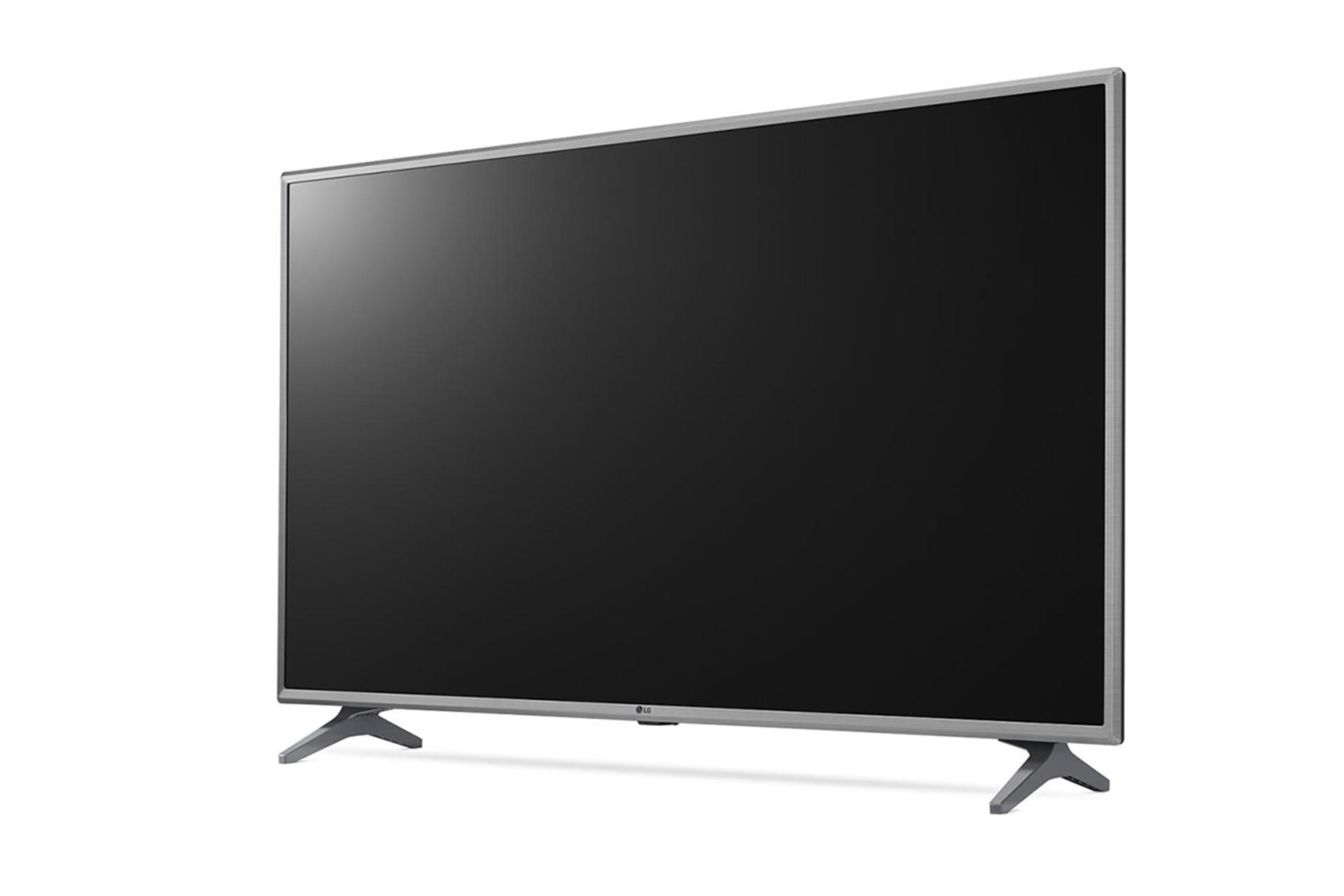  نمای نیم رخ ال جی LK6300 مدل 49 اینچ با رنگ نقره ای، صفحه خاموش و نمایش دو پایه