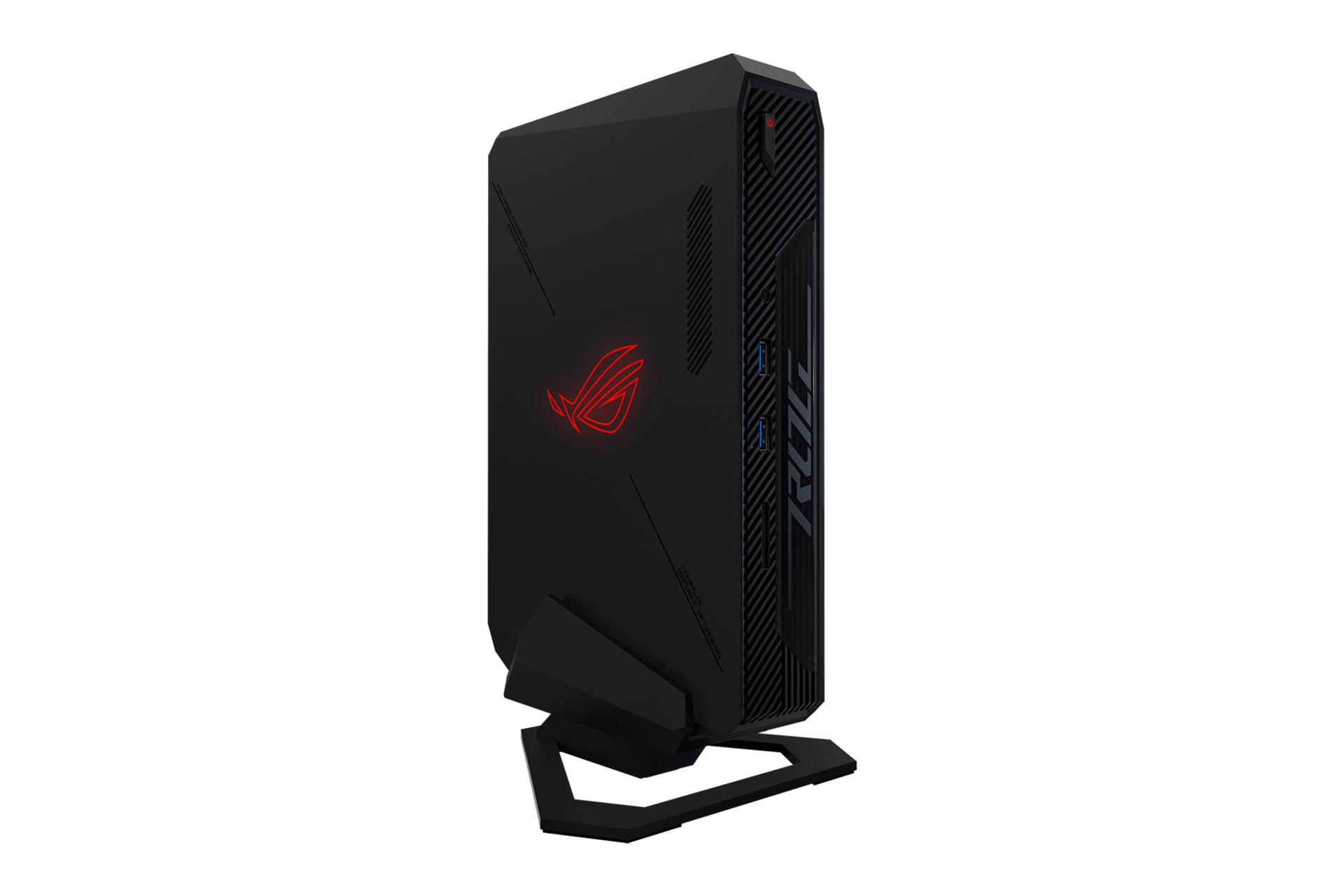 مرجع متخصصين ايران نماي نيمرخ كامپيوتر كوچك ROG NUC ايسوس در حالت ايستاده با نمايش لوگو و درگاه هاي پنل جلو