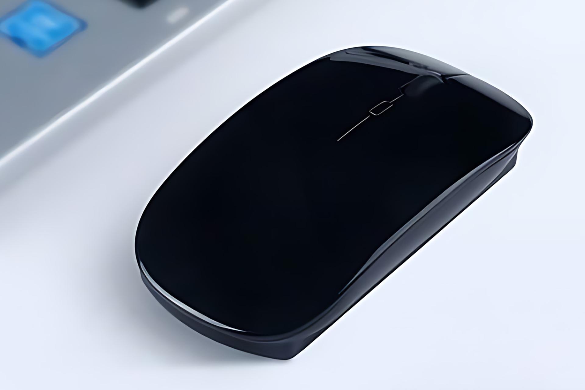 نمای کناری ماوس ریمکس Remax G10 در کنار لپ تاپ