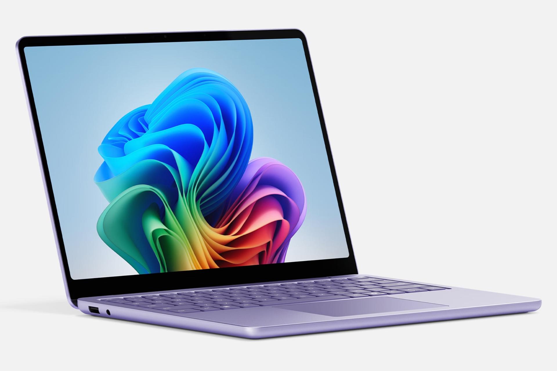 نمای نیمرخ لپ تاپ سرفیس لپ تاپ 7 مایکروسافت نسخه 13 اینچ با نمایشگر روشن و نمایش لبه سمت چپ رنگ بنفش