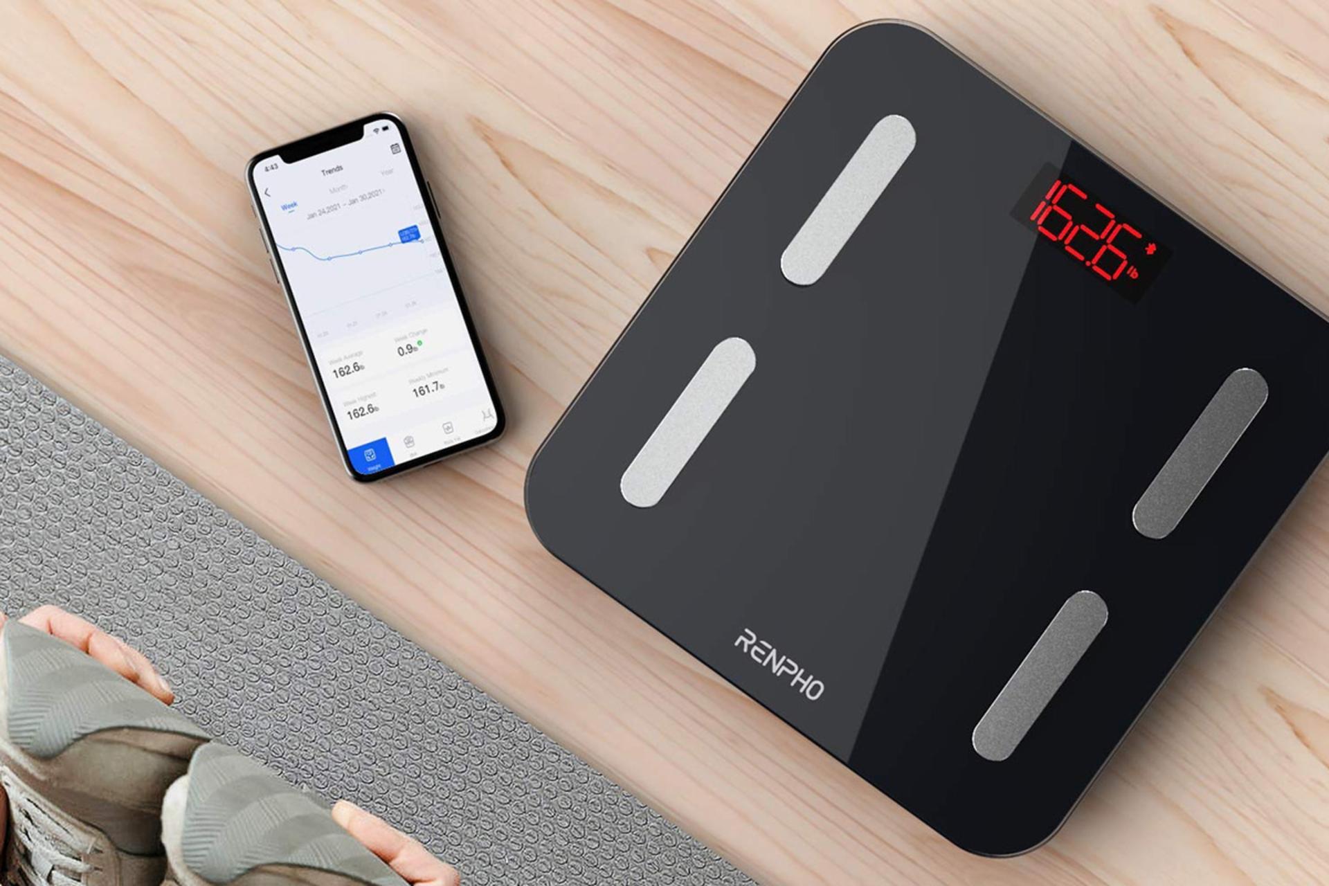 ابعاد ترازوی وزن کشی رنفو Renpho UK-R-A002-BK کنار موبایل