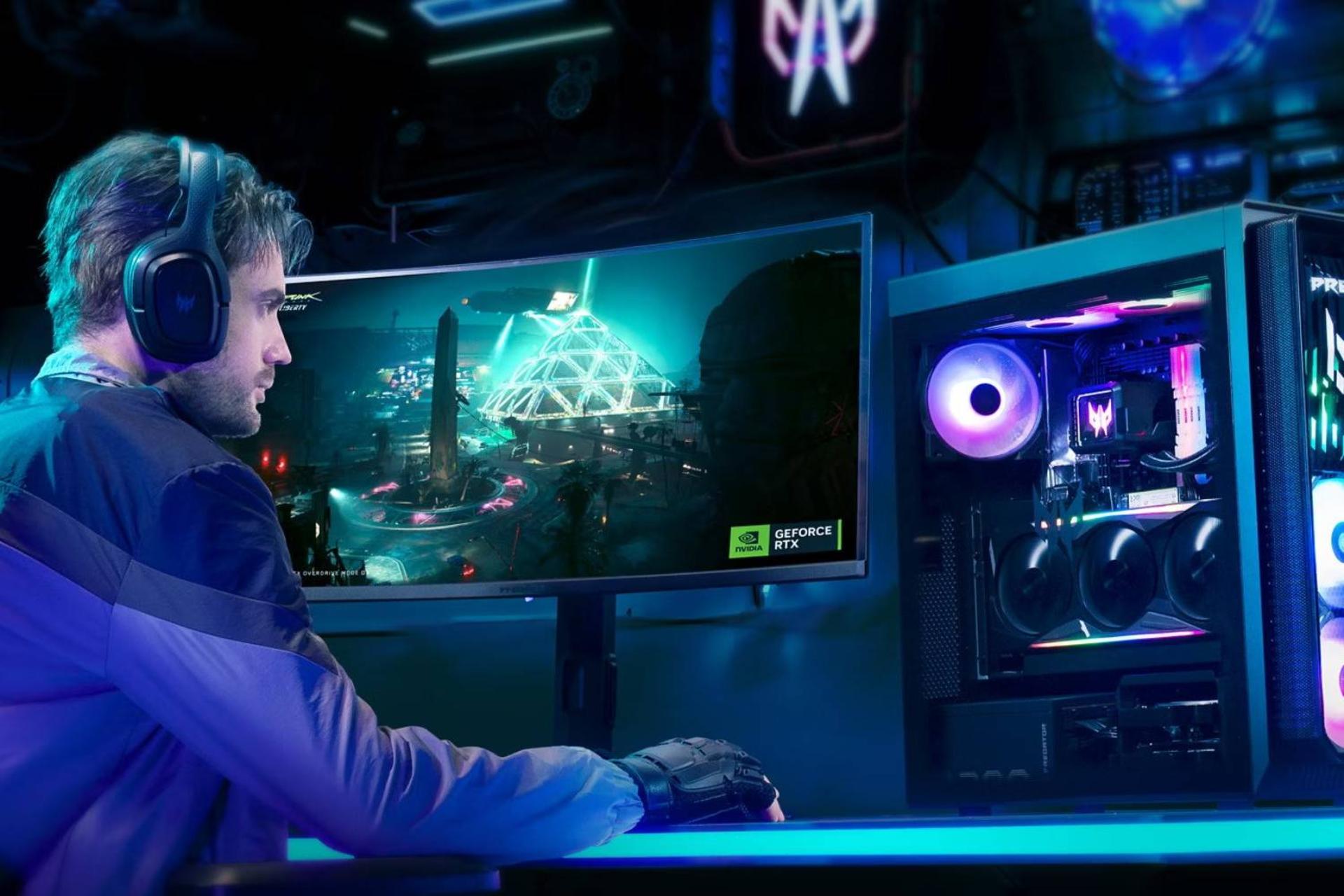 مرد جوان درحال بازی با کامپیوتر گیمینگ ایسر