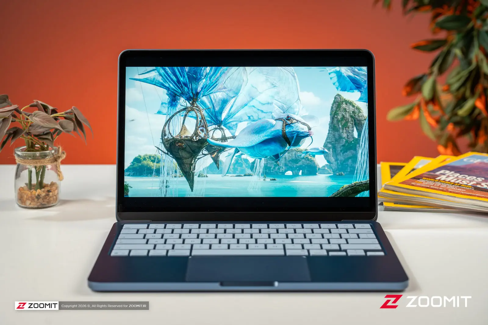 لپ‌تاپ اپل مک‌بوک نئو (Apple MacBook Neo) با نمایش تصویر فانتزی روی صفحه