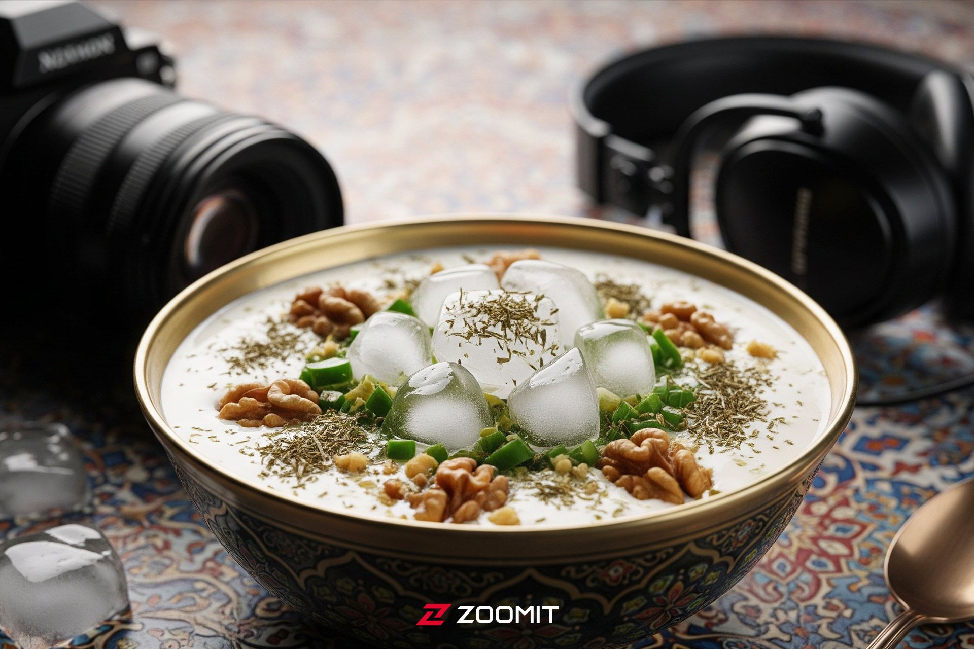 یک کاسه آبدوغ خیار در کنار دوربین و هدفون