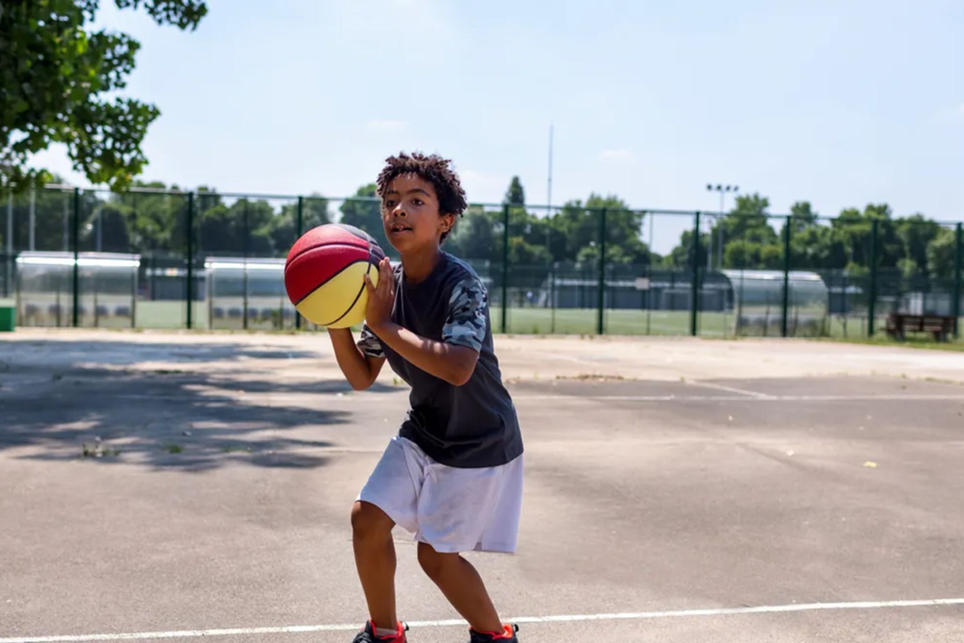 A boy playing basketball