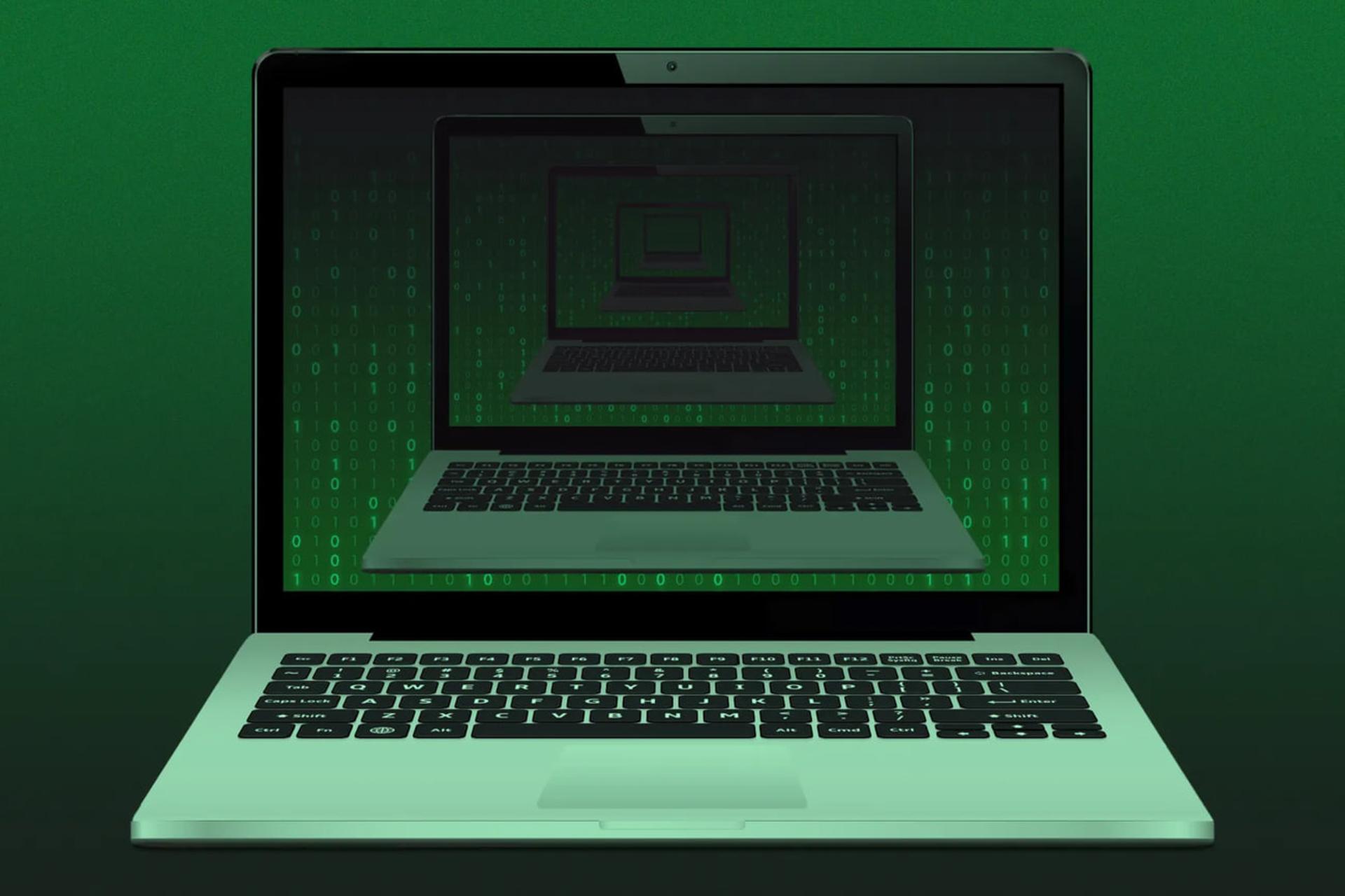 نمایش کدهای باینری سبز رنگ روی صفحه نمایش لپ‌تاپ