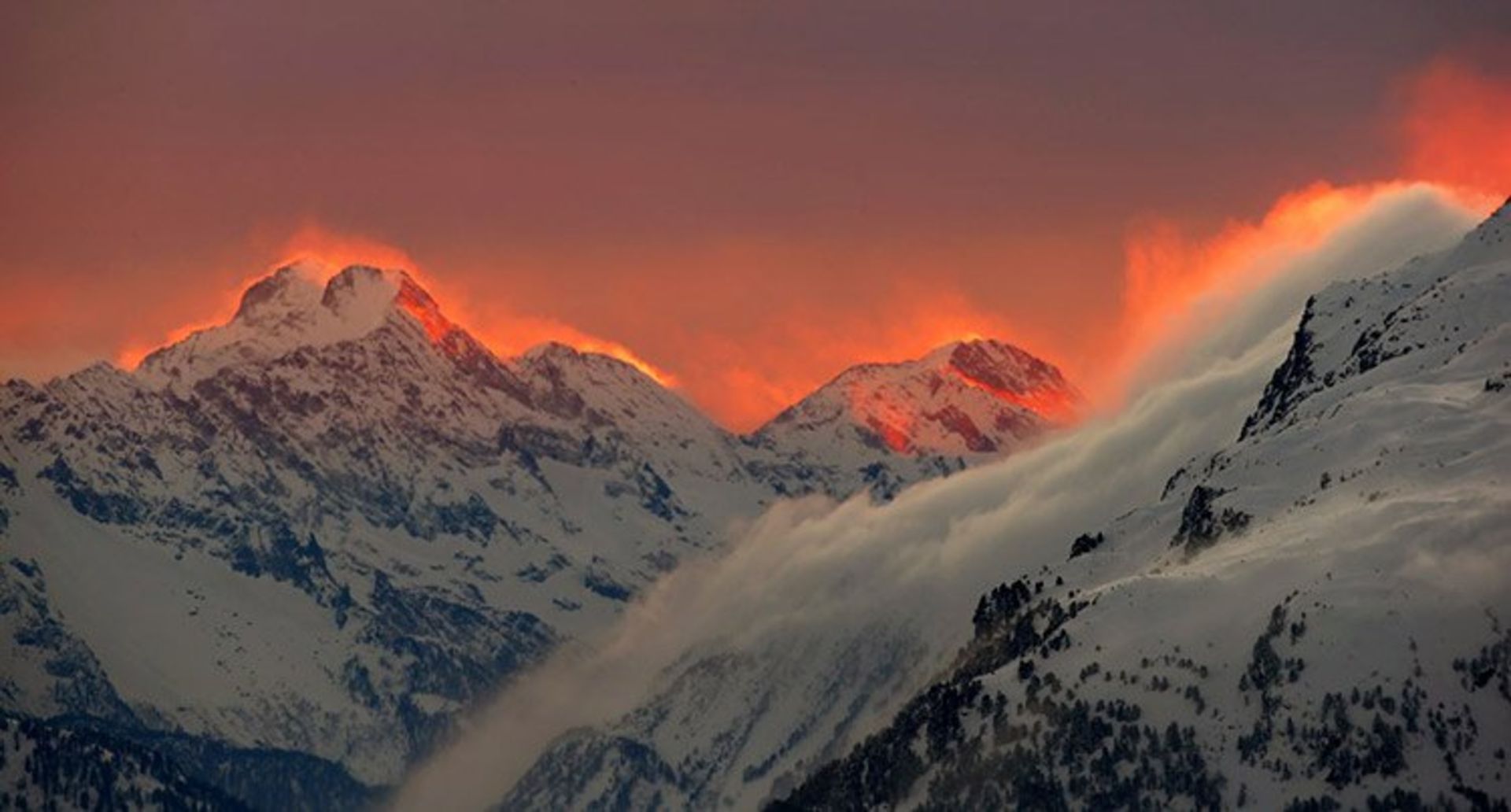 17 the sunset illuminates the peaks of the mountains near the swiss mountain resort of st moritz s bfa76
