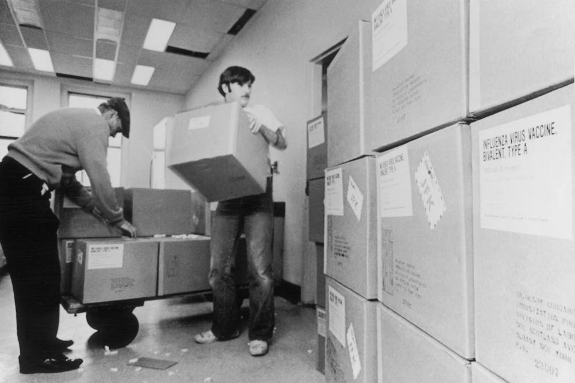 September 1976: New York State Department of Health workers unload cartons of swine flu vaccine for distribution.