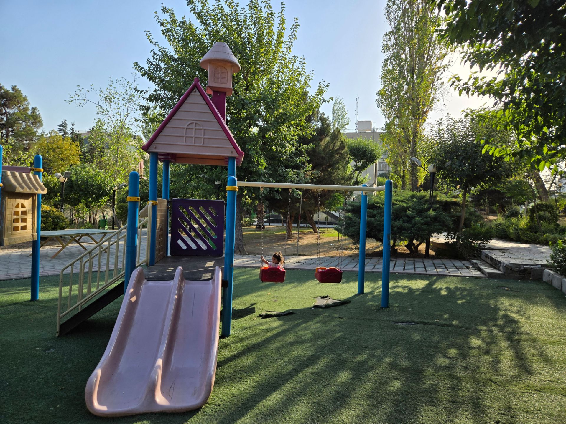 Children's swing and slide in the park