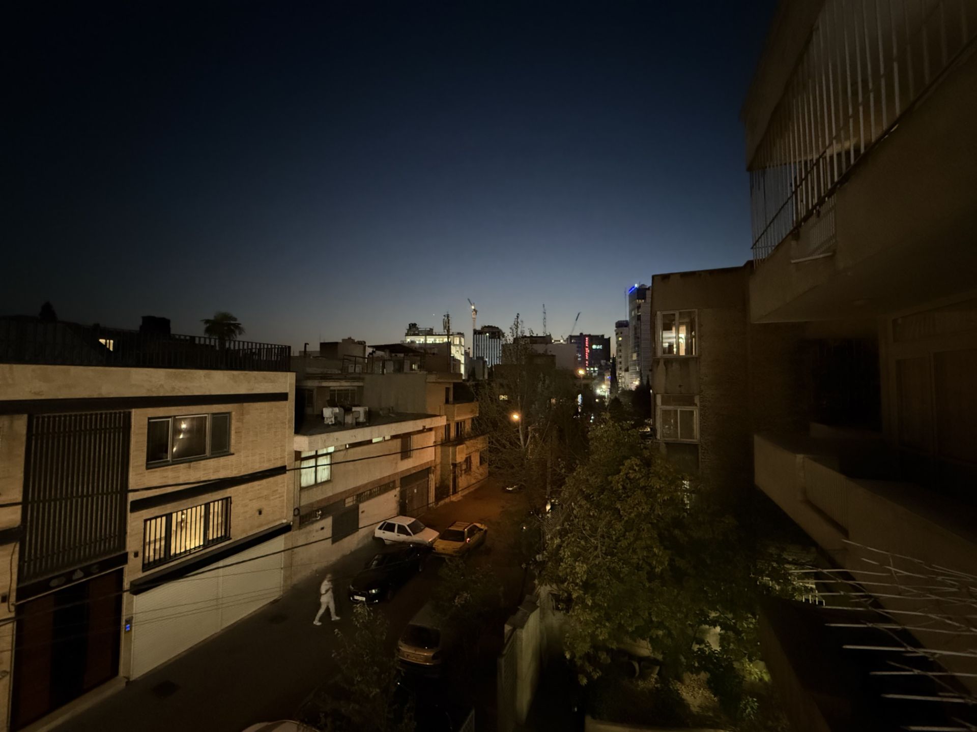 View of the buildings of Pakistan Street in Tehran at night - Ultrawide camera of iPhone 16 Pro