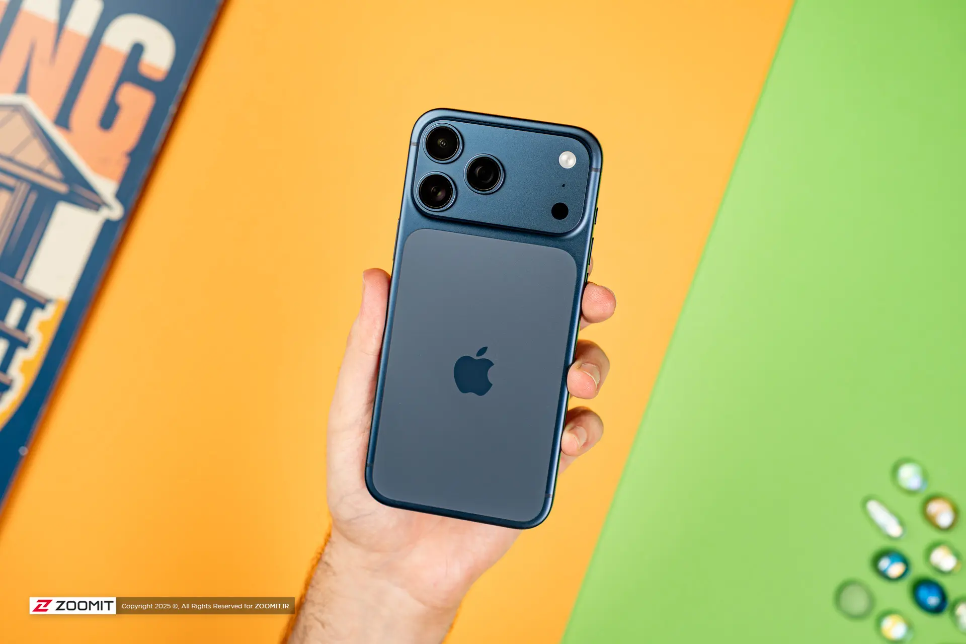آیفون ۱۷ پرو مکس / iPhone 17 Pro Max آبی از نمای پشت در دست