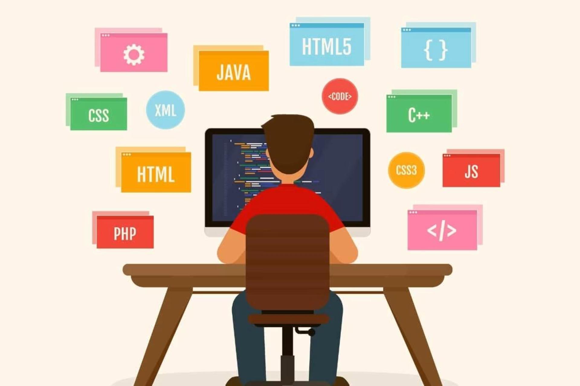 پسر درحال کار با کامپیوتر و یادگیری زبان های برنامه نویسی