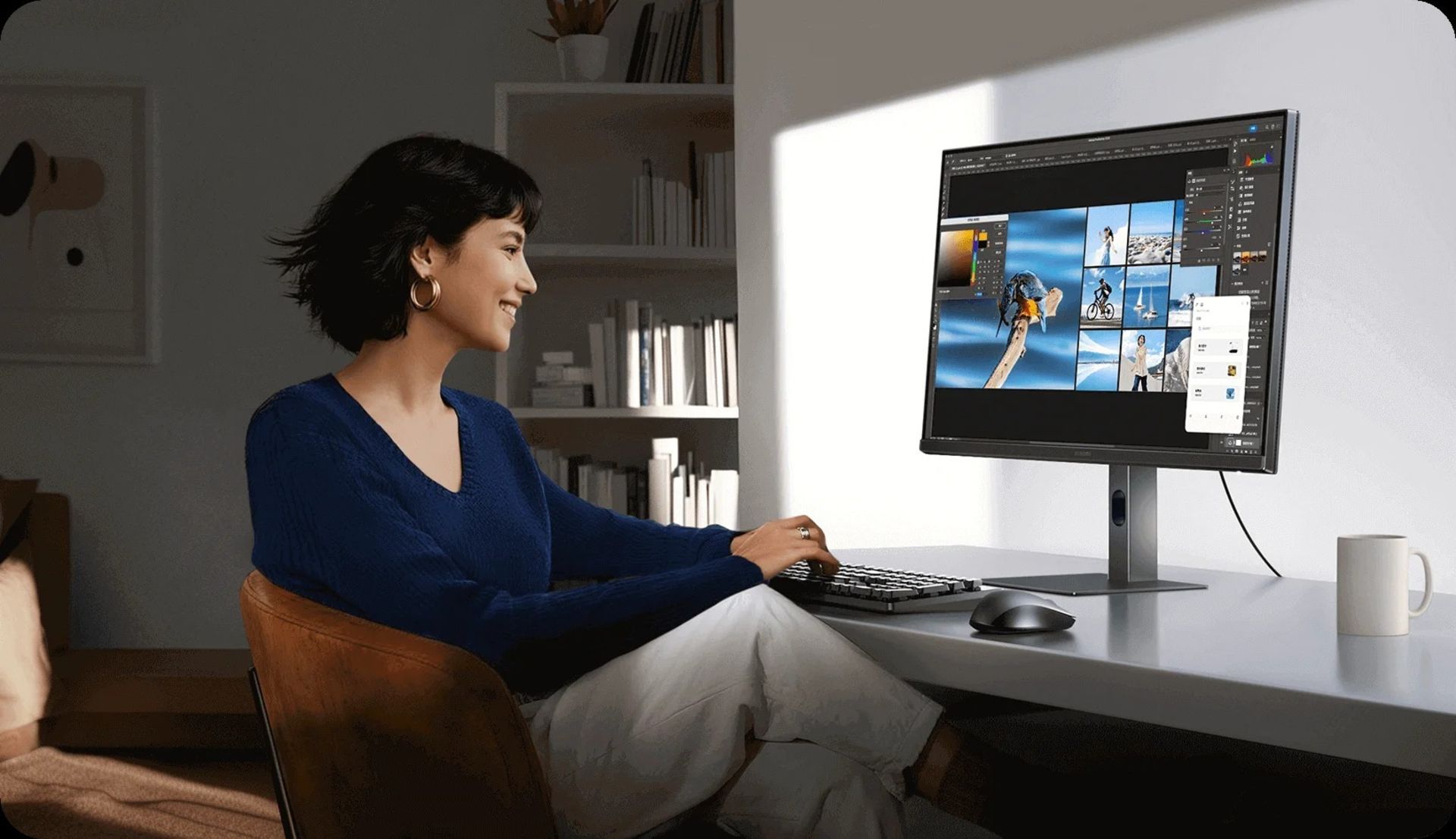 زن جوان در حال کار با مانیتور شیائومی A27Qi پشت میز