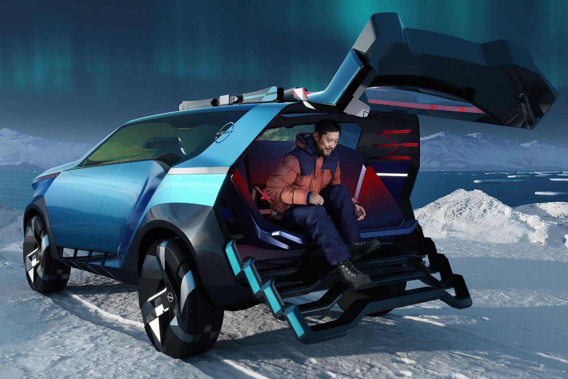 خودروی مفهومی نیسان به رنگ آبی از نمای پشت روی برف و پشت آن دریا