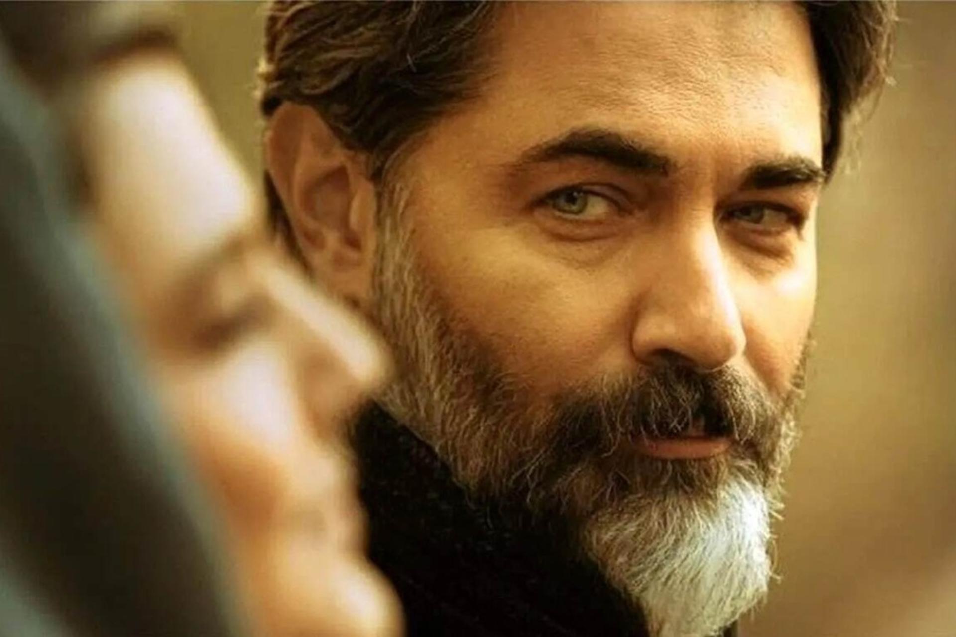 چهره‌ی مرد میان‌سال با ریش
