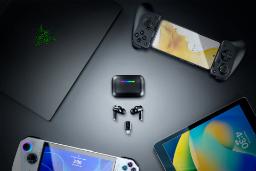 ایرباد ریزر Hammerhead V3 HyperSpeed روی میز از نمای بالا کنار گوشی و تبلت