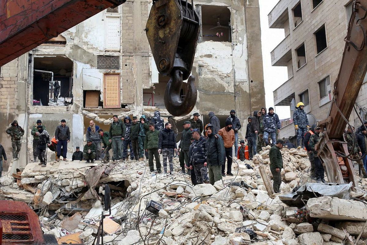 Rescuers with heavy equipment searching for survivors of the Syrian earthquake
