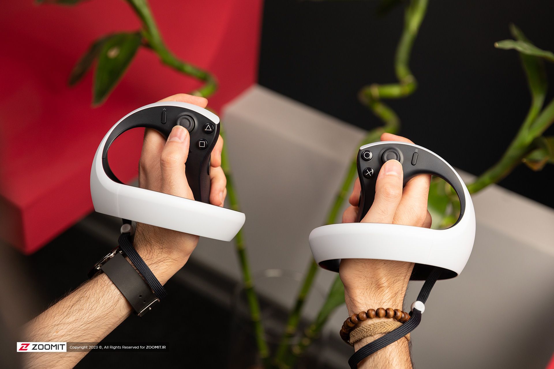 PlayStation VR2 virtual reality headset controllers in hand