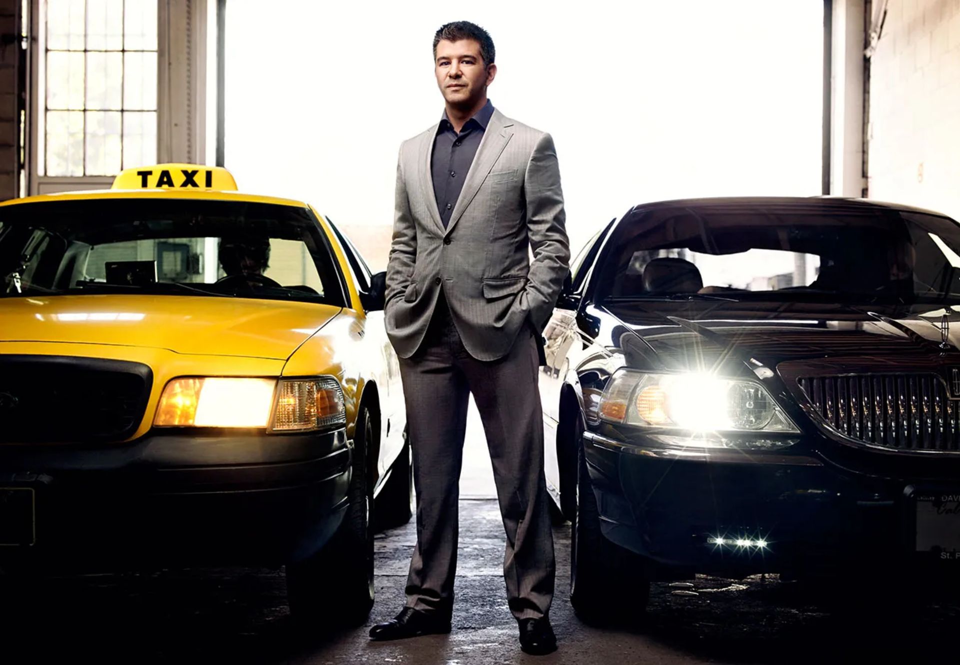 The founder of Uber between the taxi car and Uber