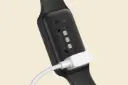 ساعت هوشمند ردمی اسمارت بند 2 شیائومی مشکی در حال شارژ / Xiaomi Redmi Smart Band 2