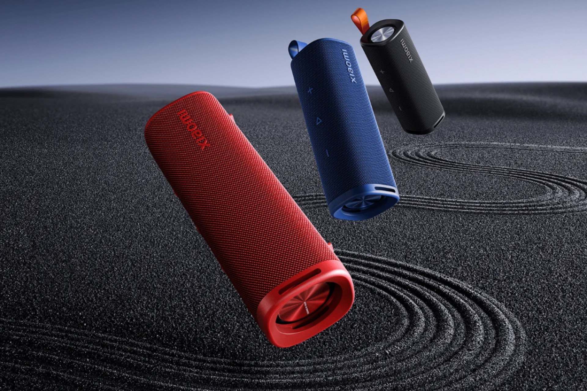سه عدد اسپیکر شیائومی Xiaomi Sound Outdoor معلق در هوا